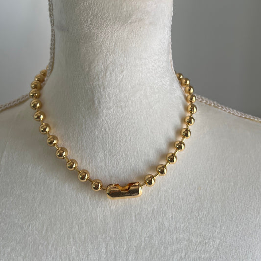 18K gold plated ball chain choker necklace displayed on a mannequin.